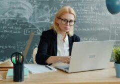 mature successful phd student at desk