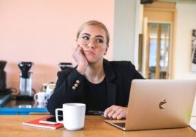 student at desk doing phd procrastination